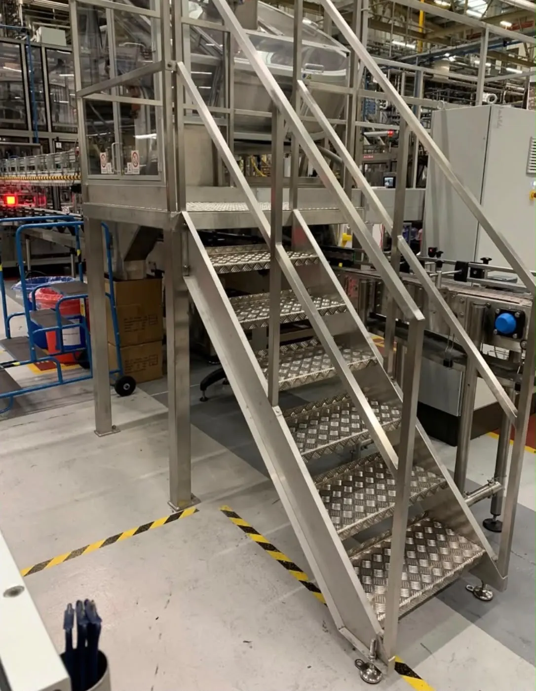 Bespoke stainless steel access staircase and platform on a packaging line