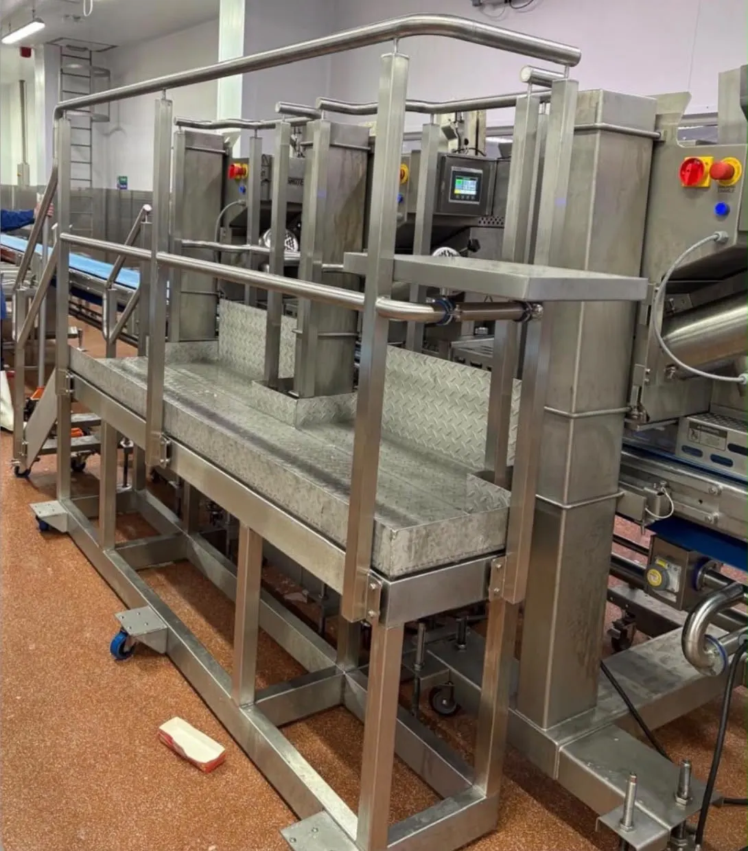 Stainless steel machine access walkway over a slicing line