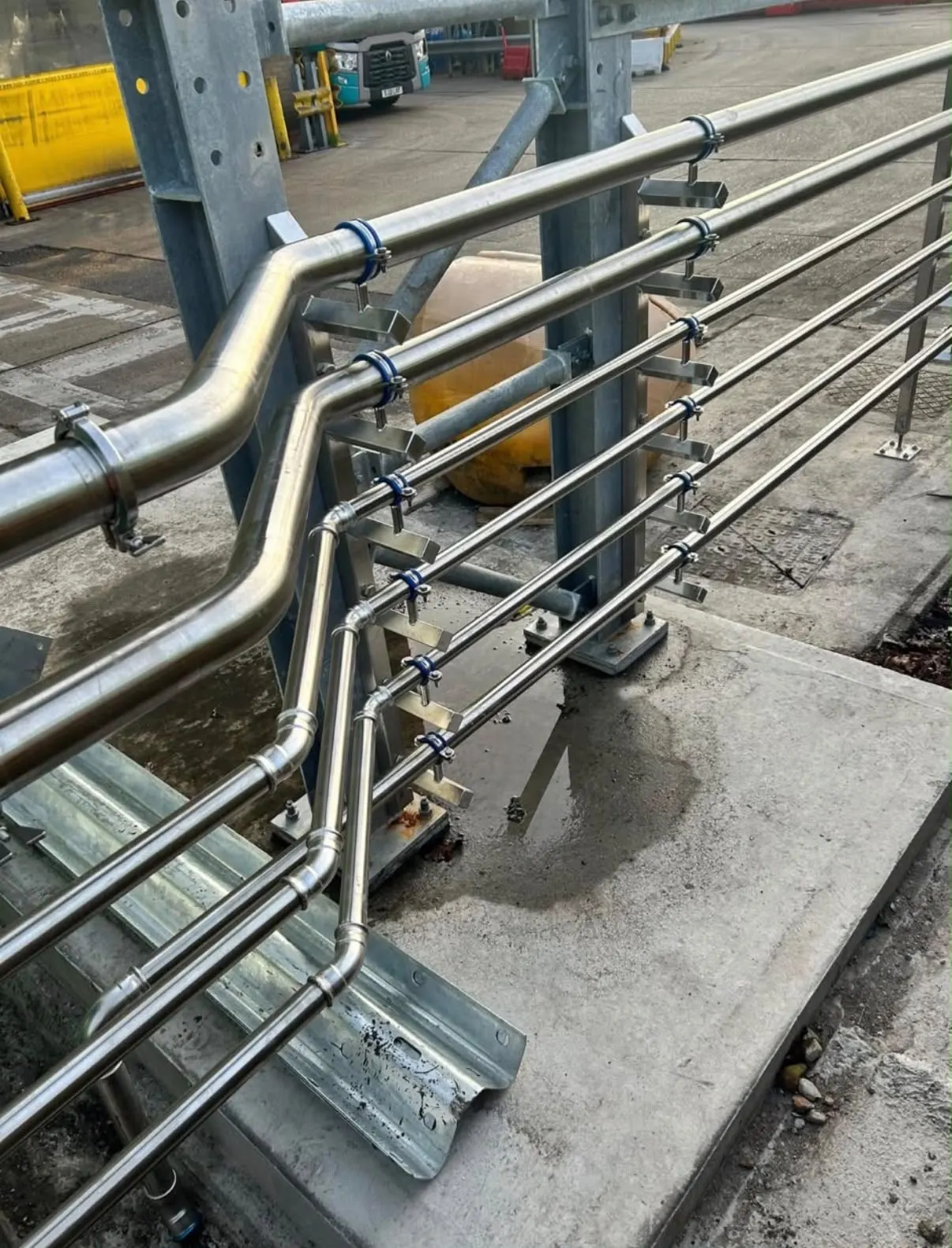 Polished stainless steel process pipework run, precision-bent and clamped